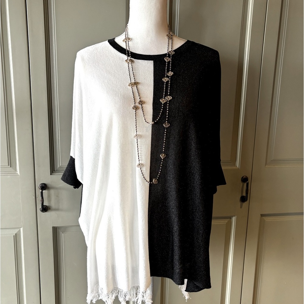 Size large tunic in lightweight black and white knit.